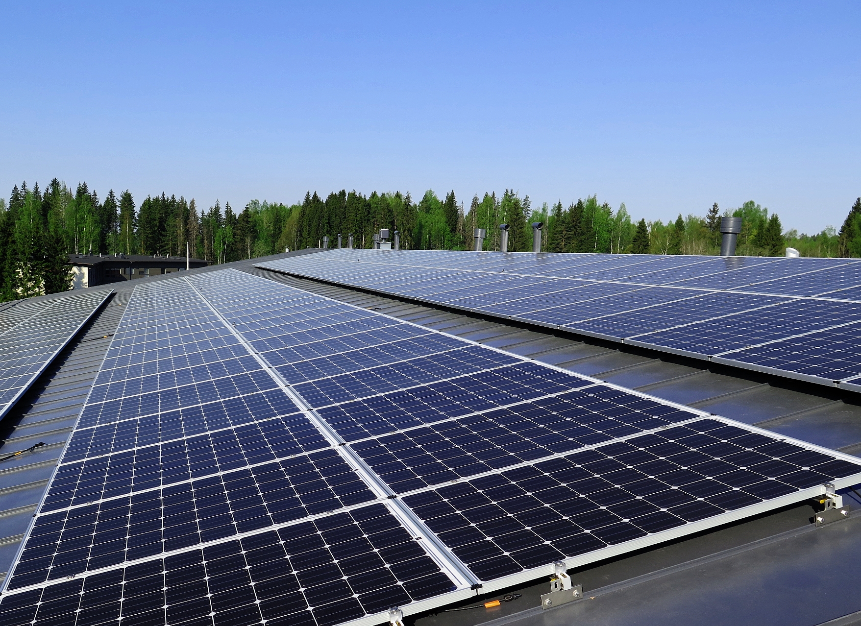 Solar panels on top of a building's roof.